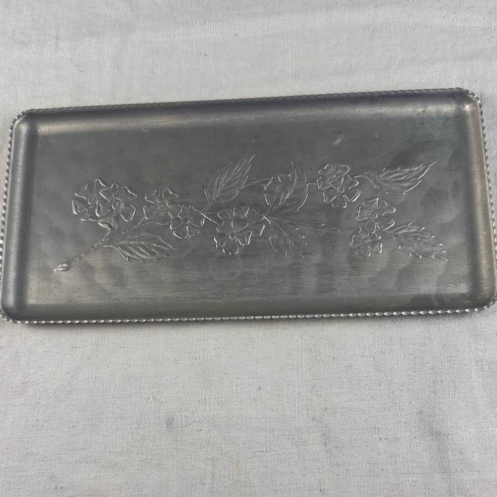 Vintage hammered aluminum vanity or serving tray with an embossed floral design